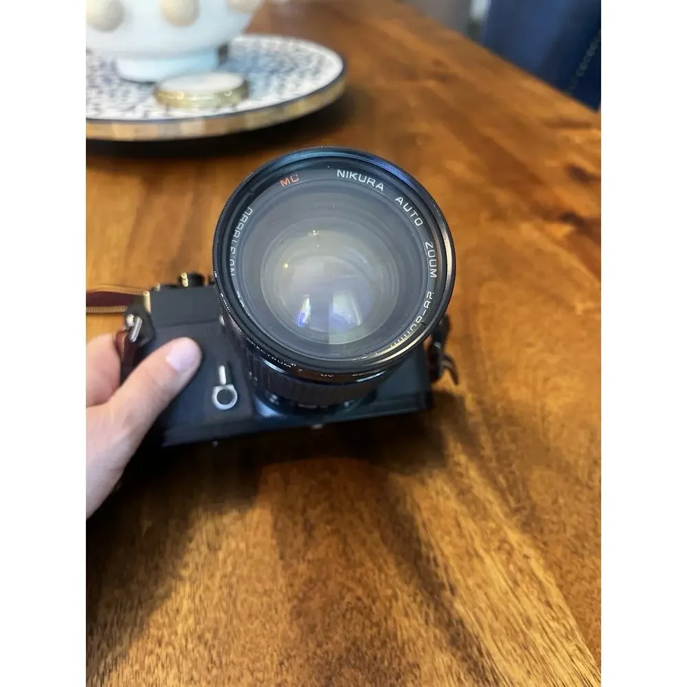Nikon Black Camera with Brown Strap